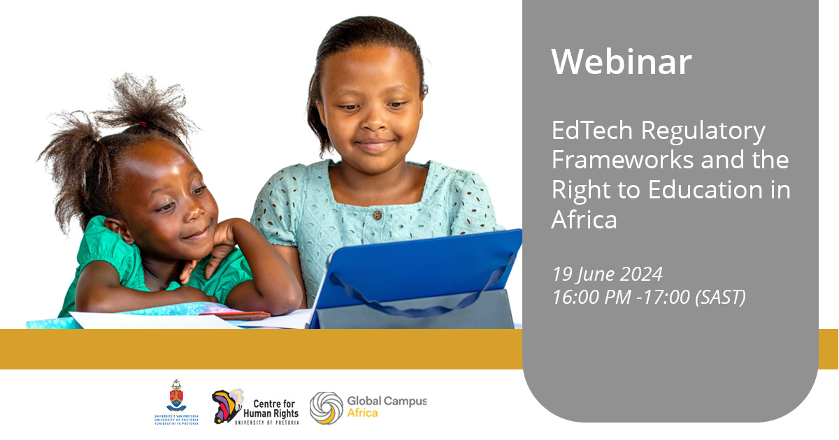 Portrait of Two little African kids looking together at digital tablet at table. 