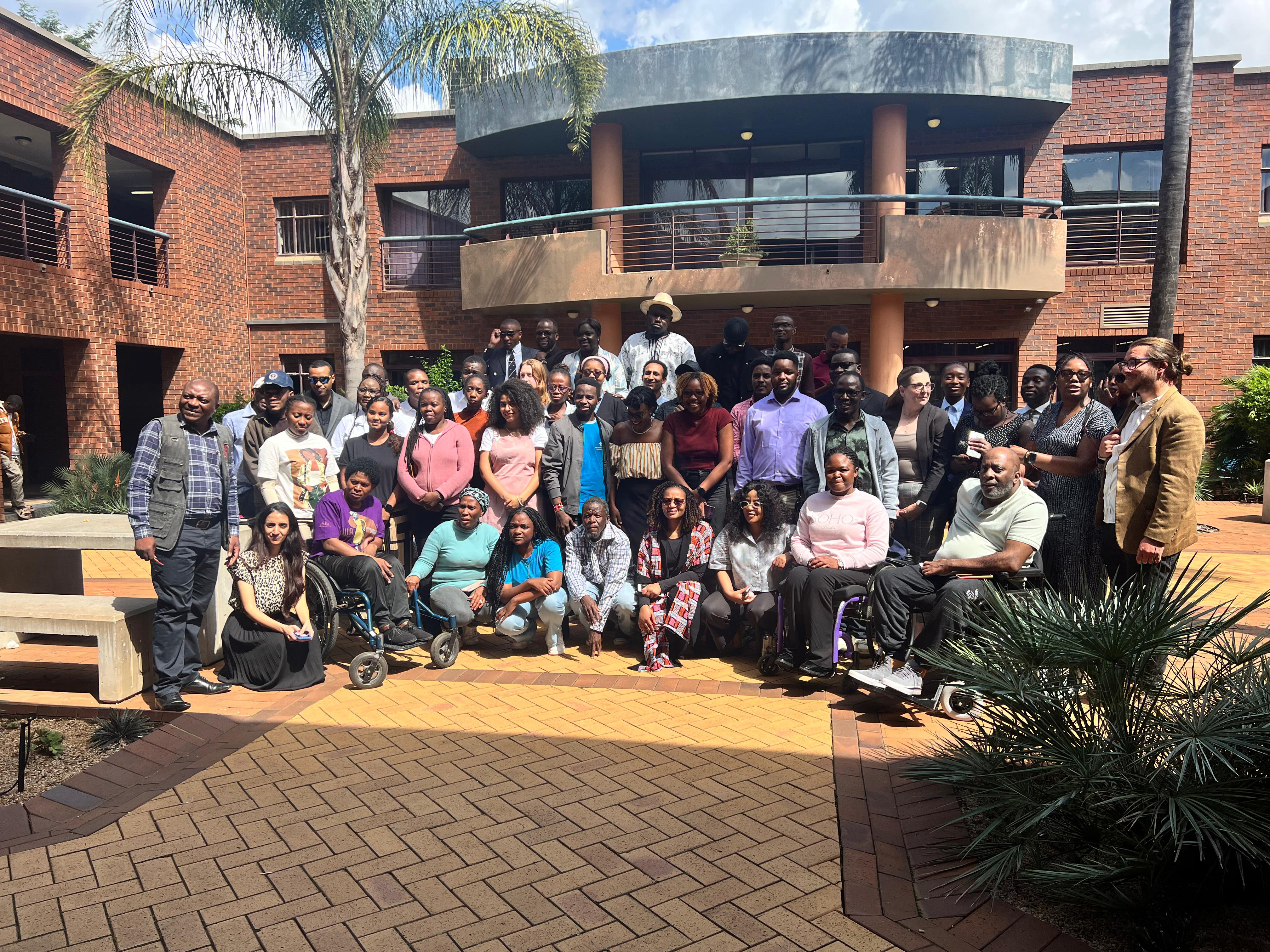Image 4 - Group image which was taken on day 3 of the short course. The group photo consists of approximately 50 people (students, external participants, as well as guest speakers and Centre for Human Rights staff). The image was taken in an outdoor courtyard on a bright and sunny day. 